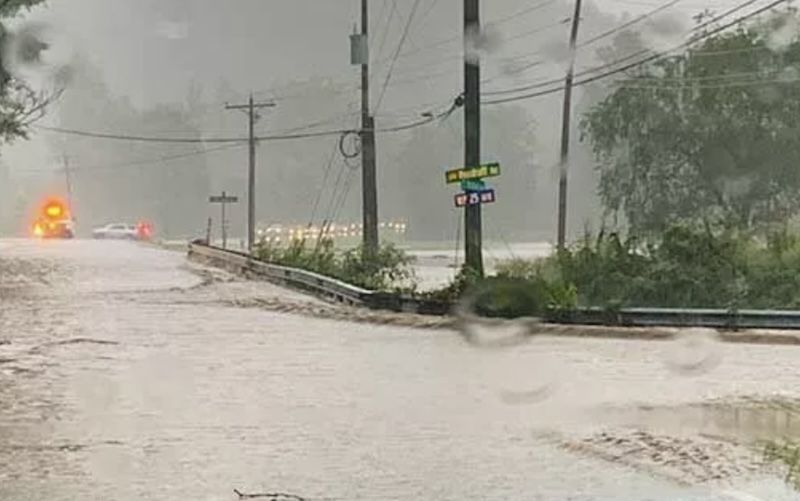 A road floods during Hurricane Helene